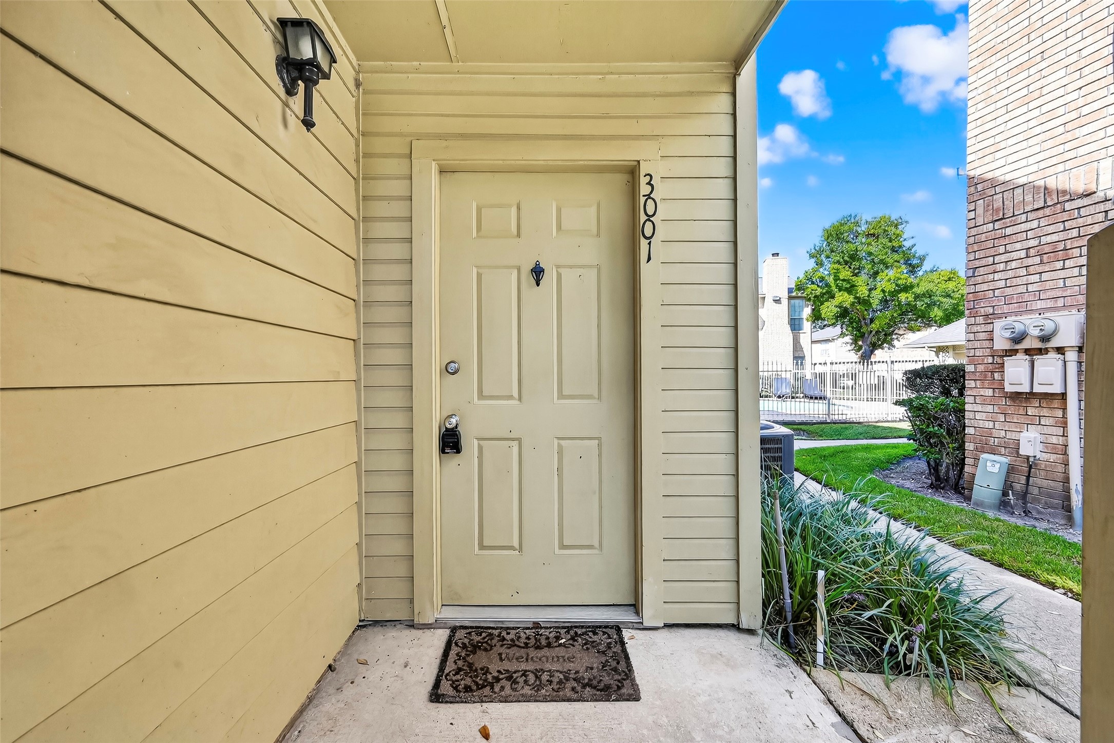 1515 Sandy Springs Road, Unit 3001 Houston, TX 77042 - Photo 26 of 28 a view of a door and wooden floor