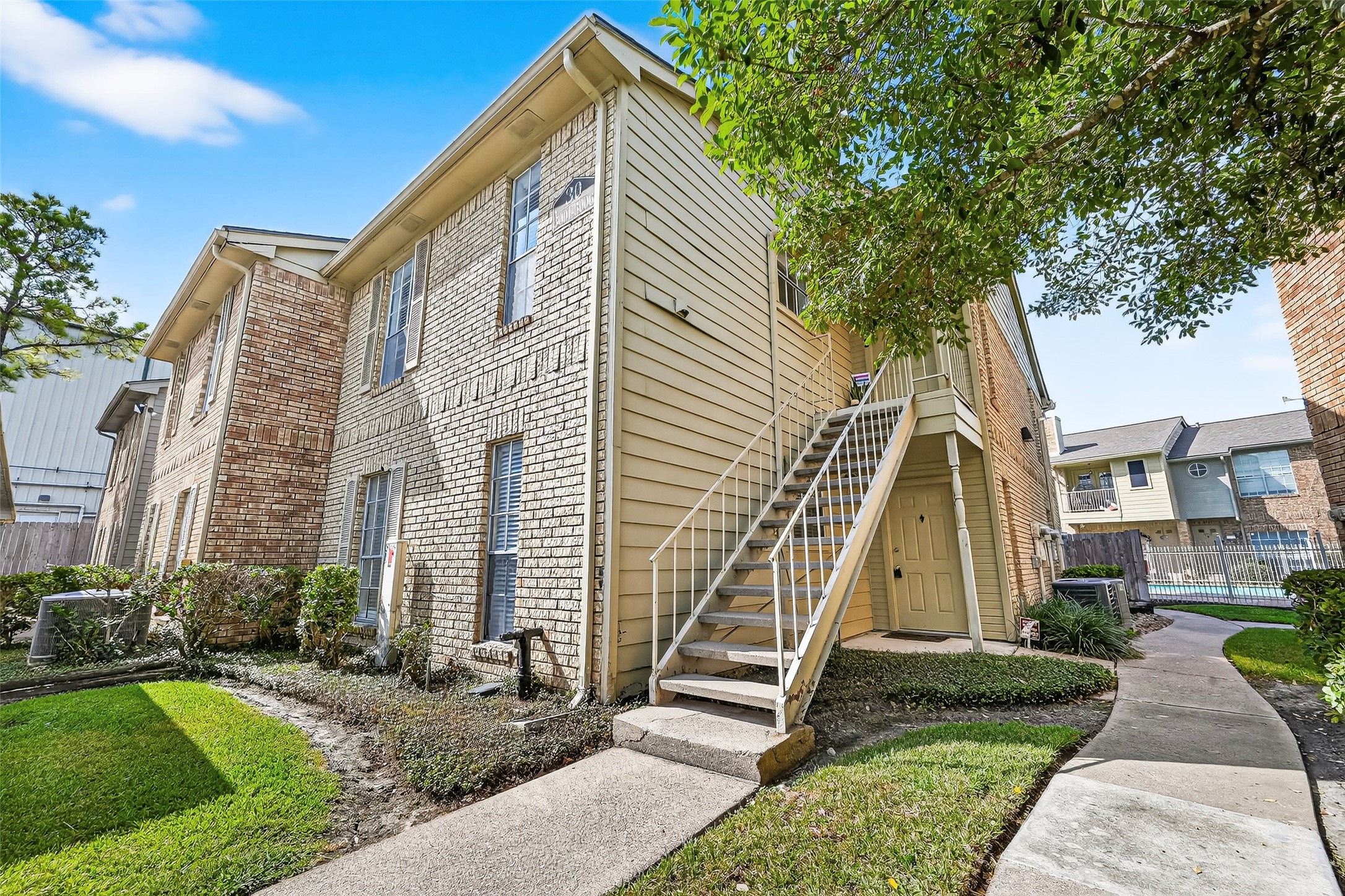 1515 Sandy Springs Road, Unit 3001 Houston, TX 77042 - Photo 28 of 28 a view of a house with a yard