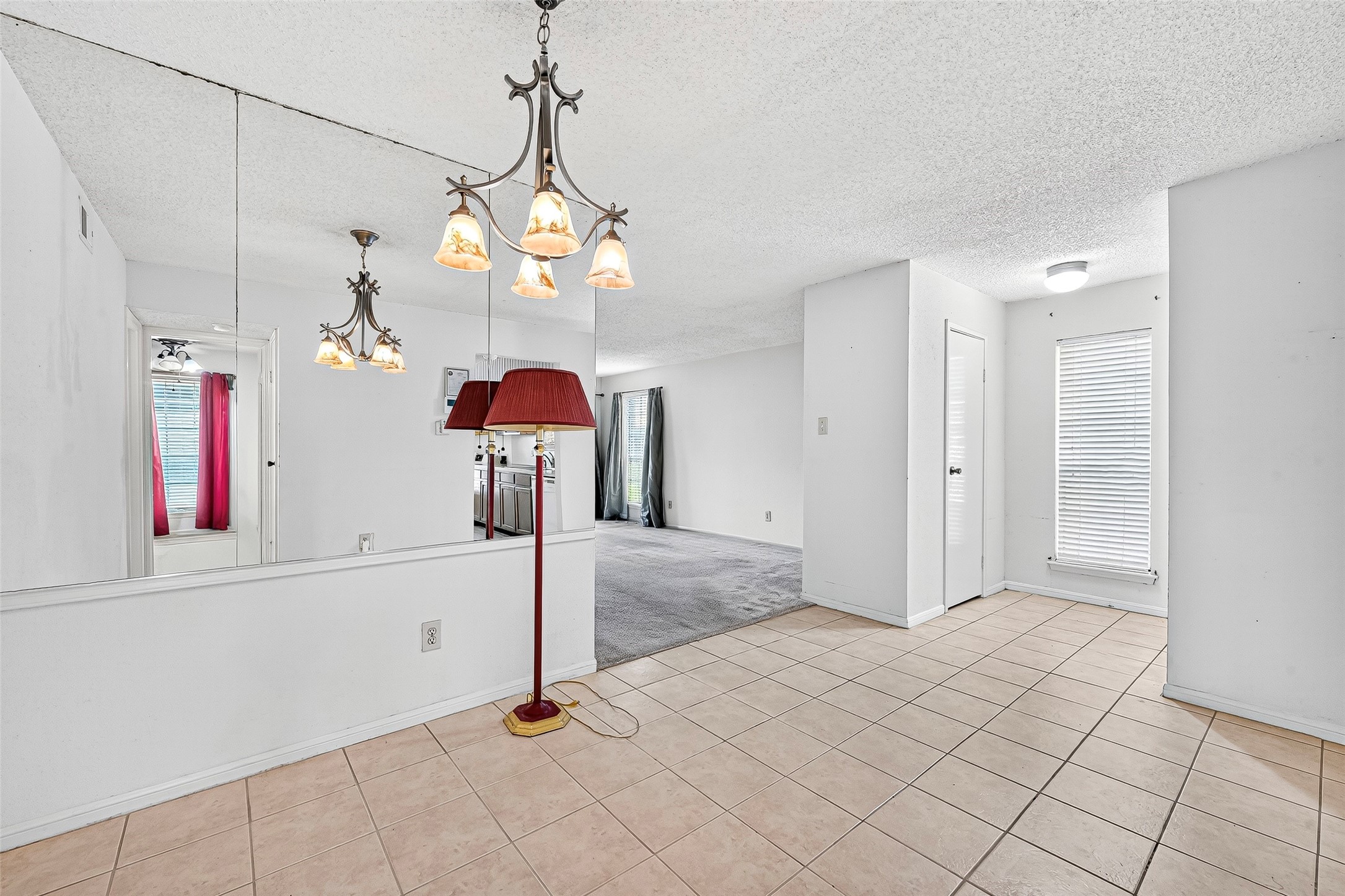 1515 Sandy Springs Road, Unit 3001 Houston, TX 77042 - Photo 4 of 28 a view of a hallway with chandelier