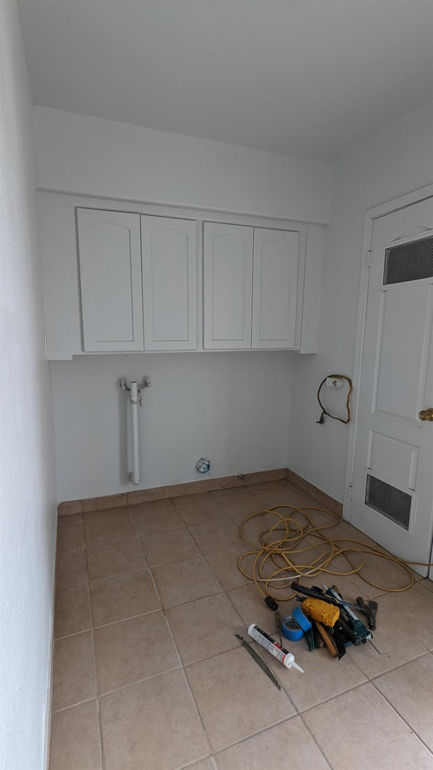 930 Sierra Street Madera, CA 93638 - Photo 14 of 16 a kitchen with a sink and cabinets