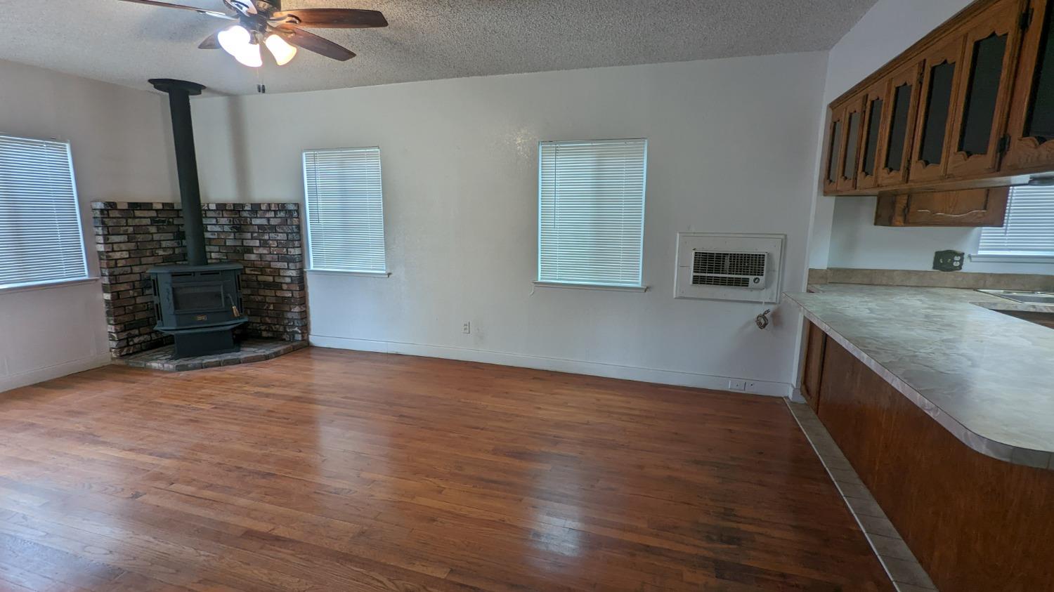 930 Sierra Street Madera, CA 93638 - Photo 3 of 16 a view of kitchen with furniture and a ceiling fan
