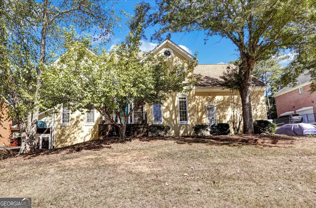 a living room with furniture and a lamp