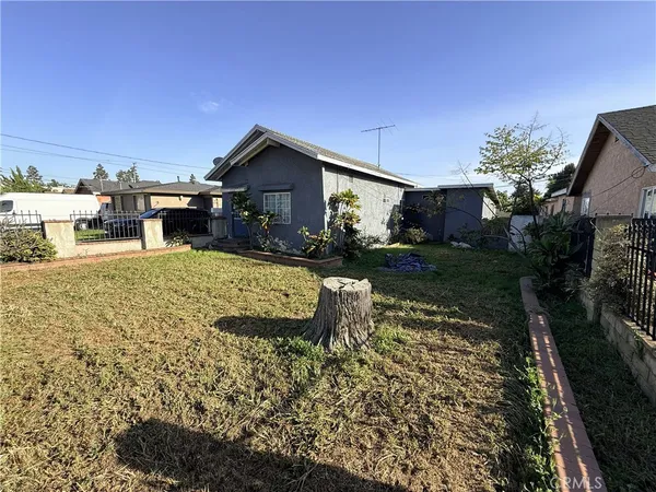 a view of a house with backyard porch and sitting area
