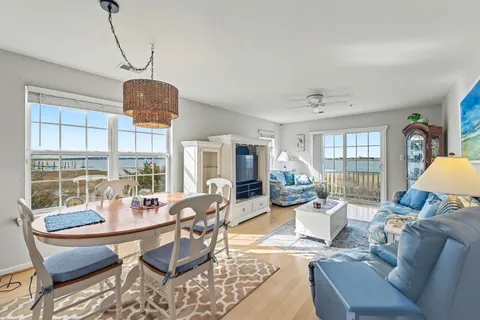 a kitchen with stainless steel appliances granite countertop a sink a stove and refrigerator