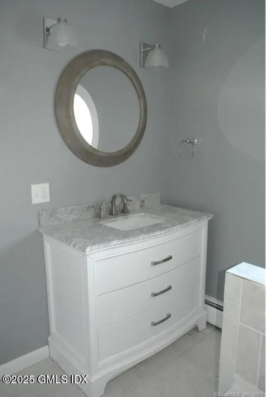 300-302 Soundview Avenue, Unit 2 Fairfield, CT 06825 - Photo 16 of 20 a bathroom with a granite countertop sink and a mirror