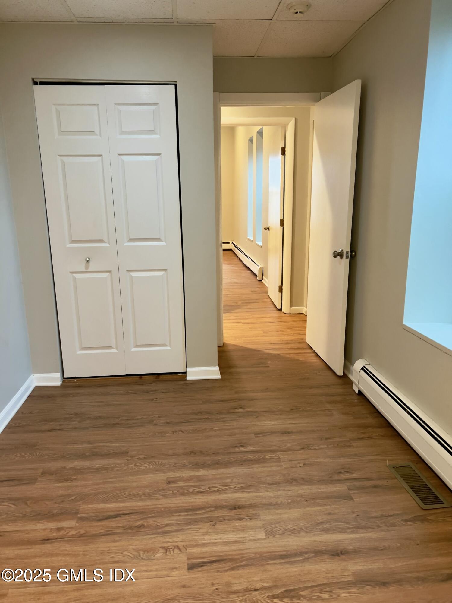 300-302 Soundview Avenue, Unit 2 Fairfield, CT 06825 - Photo 18 of 20 a view of a hallway with wooden floor