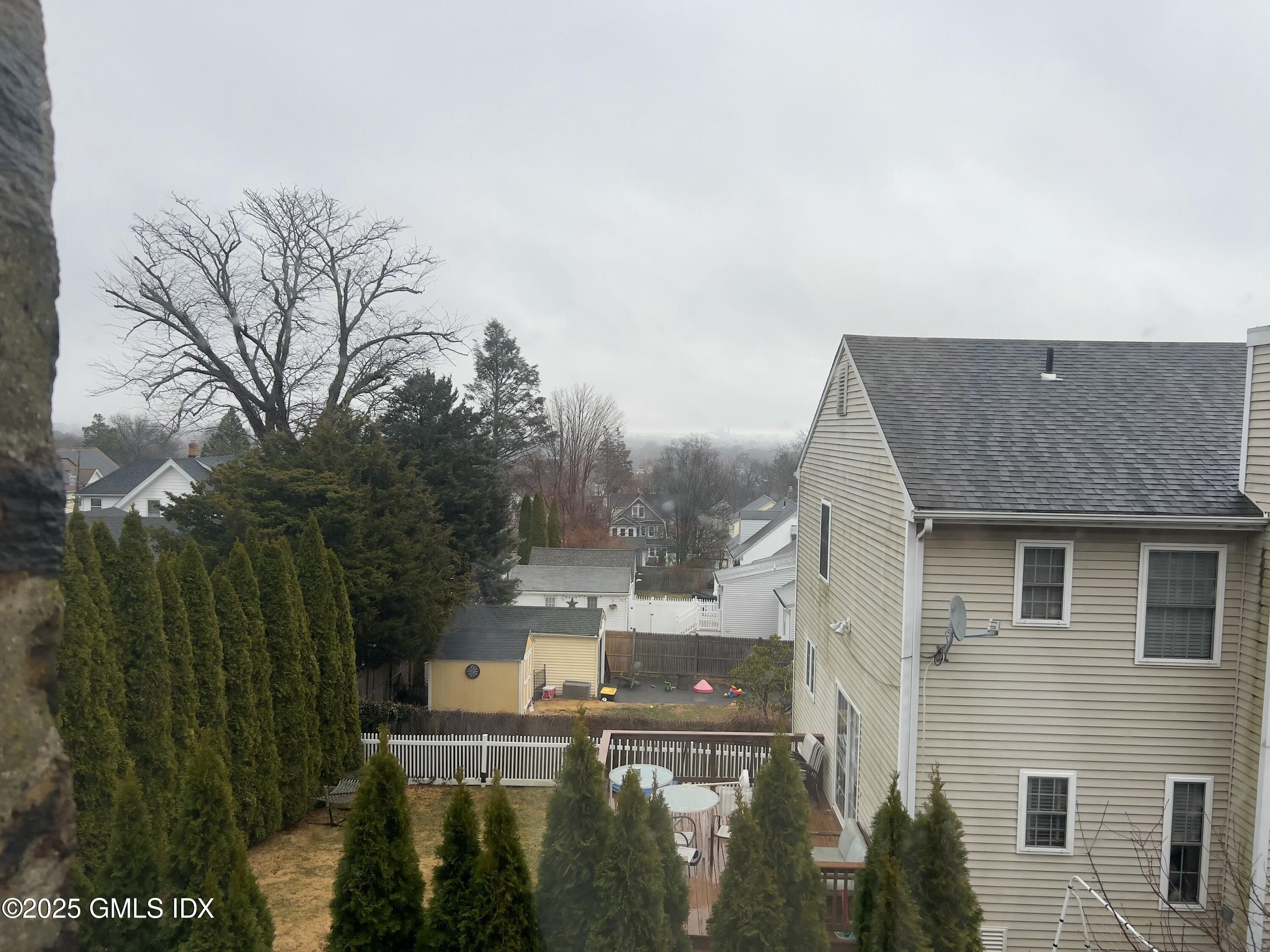 300-302 Soundview Avenue, Unit 2 Fairfield, CT 06825 - Photo 4 of 20 a view of a house with a yard