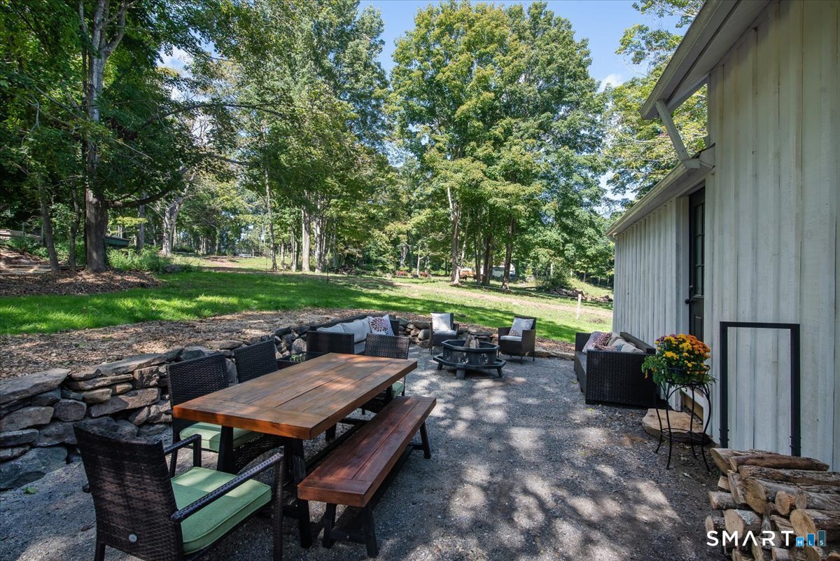 79 Seckar Road Willington, CT 06279 - Photo 20 of 38 Large Patio with a beautiful stone wall border.