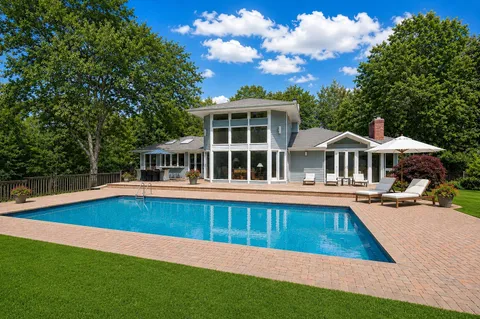 a view of swimming pool with lounge chair