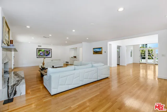 an aerial view of residential houses with outdoor space and street view