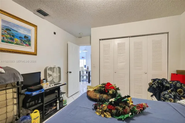 a room with furniture a chandelier and a fireplace