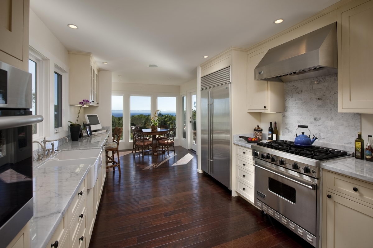1075 Cold Spring Road Montecito, CA 93108 - Photo 3 of 7 a kitchen with stainless steel appliances a stove a sink a refrigerator cabinets and wooden floor