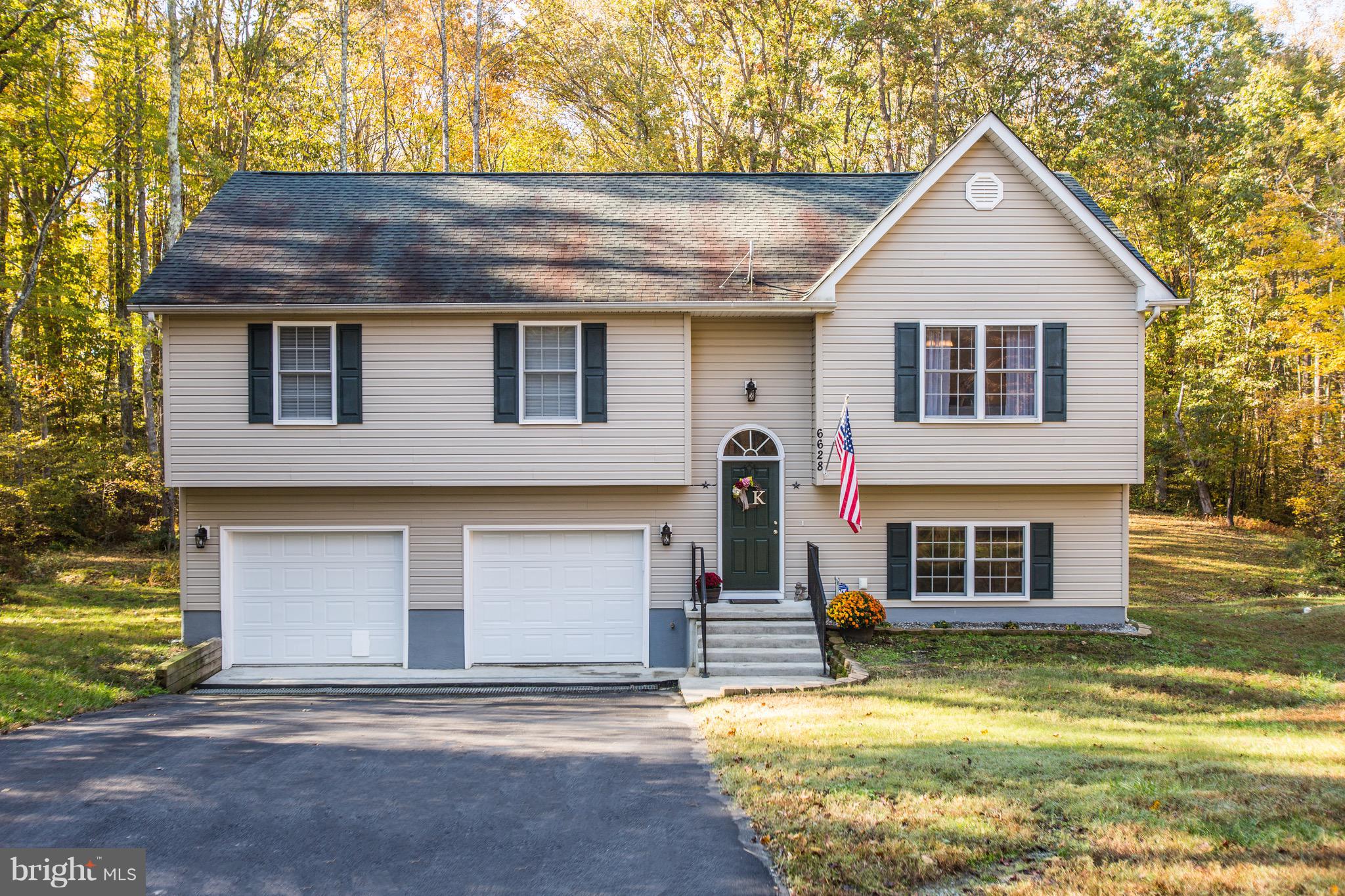 6628 Partlow Road Spotsylvania, VA 22551 - Photo 1 of 22 a front view of a house with a yard