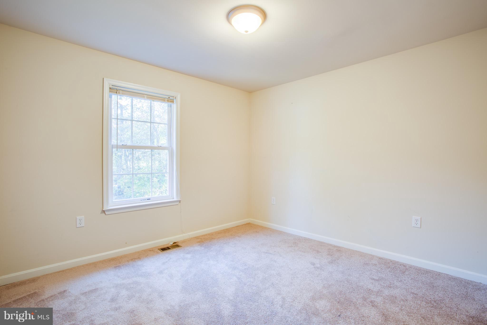 6628 Partlow Road Spotsylvania, VA 22551 - Photo 11 of 22 an empty room with a window