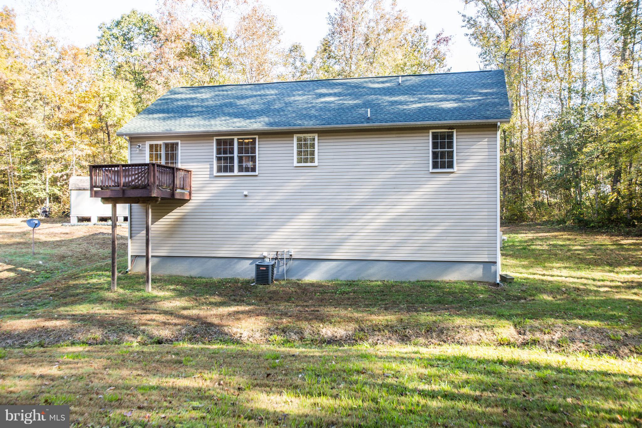 6628 Partlow Road Spotsylvania, VA 22551 - Photo 20 of 22 a view of a house with a swimming pool