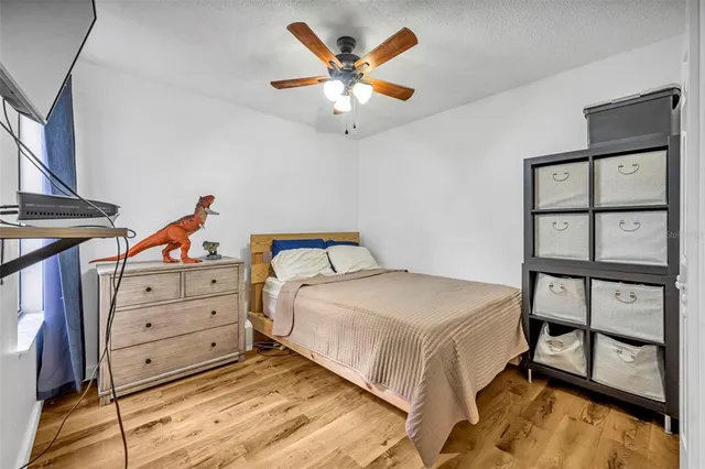 a bedroom with a bed and dresser