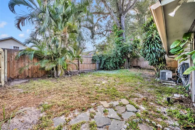 a backyard of a house with lots of green space