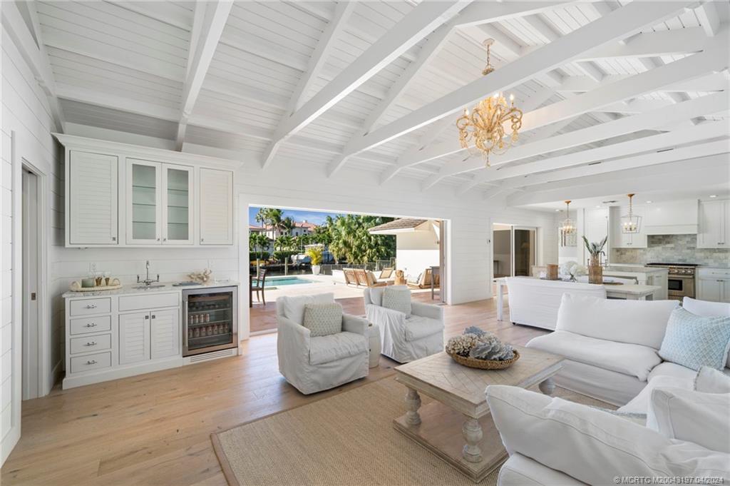 19 River Drive Jupiter, FL 33469 - Photo 11 of 46 a living room with furniture and a large window