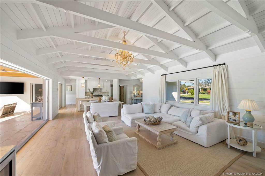 19 River Drive Jupiter, FL 33469 - Photo 12 of 46 a living room with furniture and a flat screen tv