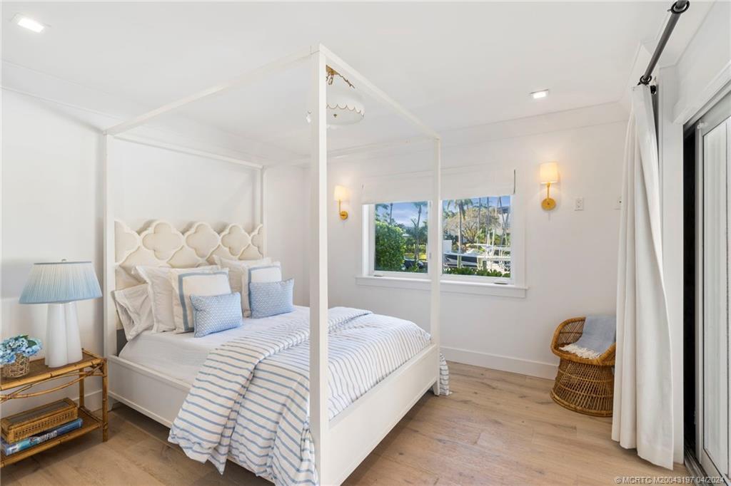 19 River Drive Jupiter, FL 33469 - Photo 33 of 46 a bedroom with a bed and a window