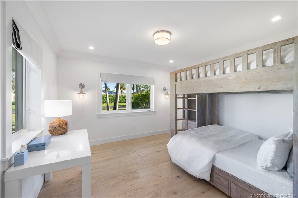 19 River Drive Jupiter, FL 33469 - Photo 38 of 46 a bedroom with a bed and a window