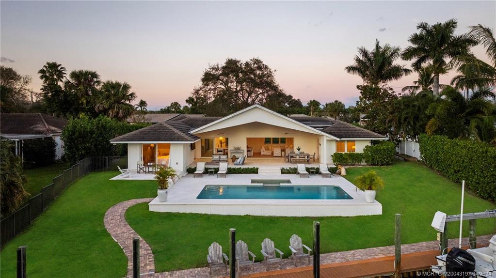 19 River Drive Jupiter, FL 33469 - Photo 43 of 46 a front view of house with yard and green space