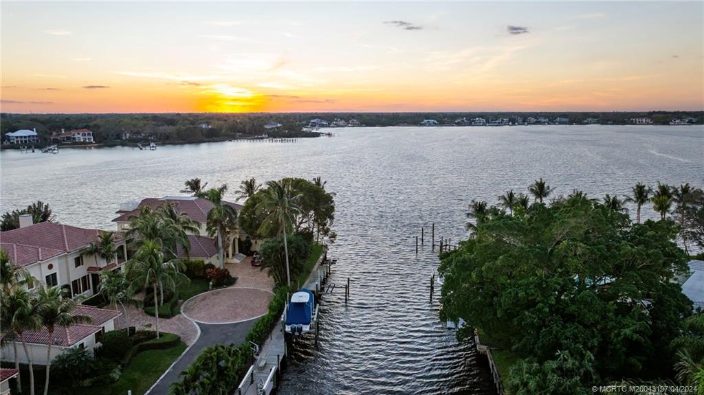 19 River Drive Jupiter, FL 33469 - Photo 44 of 46 a view of a lake with sitting area