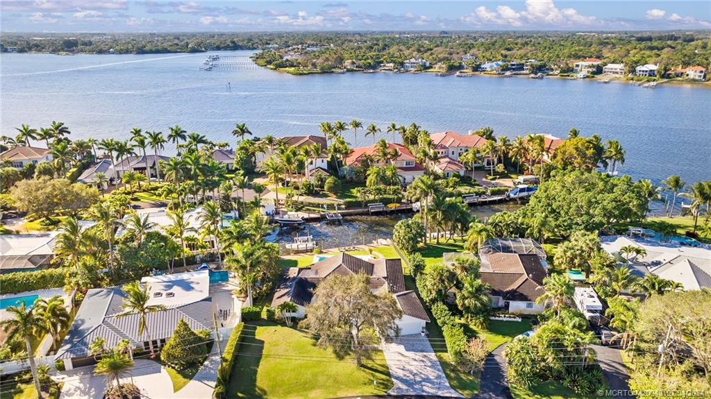 19 River Drive Jupiter, FL 33469 - Photo 46 of 46 a view of a lake with a building in the background
