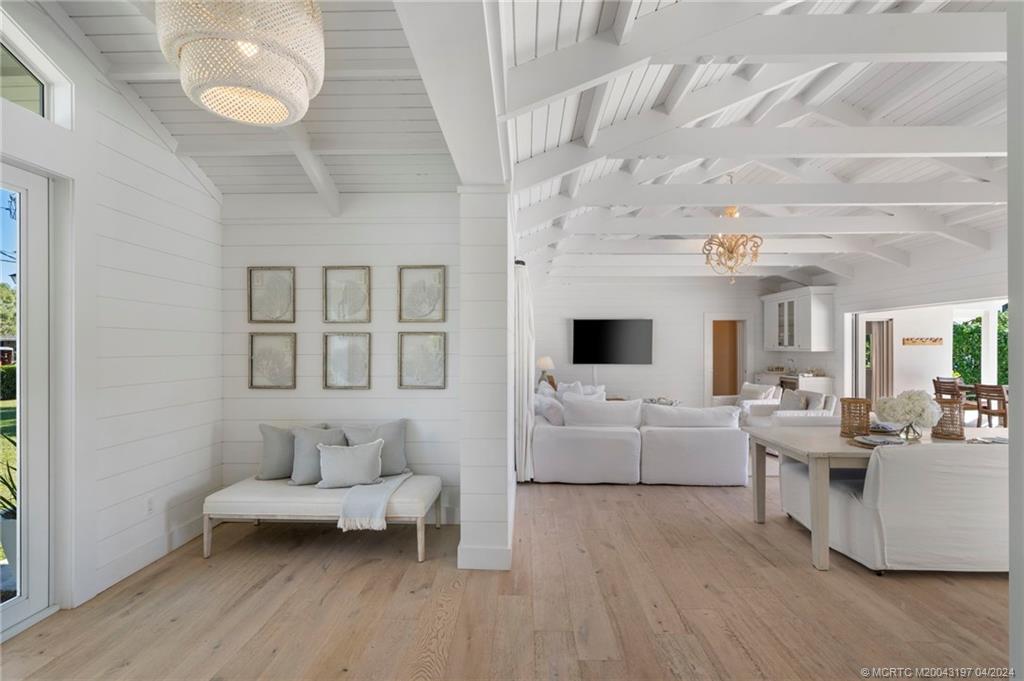 19 River Drive Jupiter, FL 33469 - Photo 8 of 46 a living room with furniture and a flat screen tv