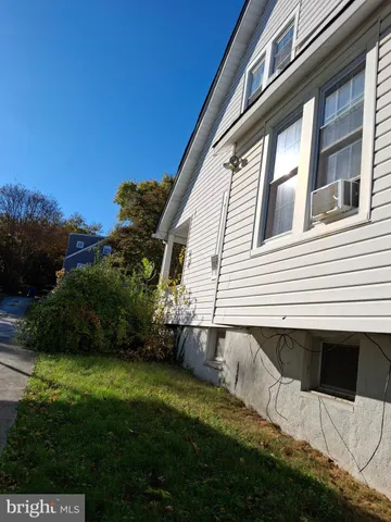 a aerial view of a house with a yard