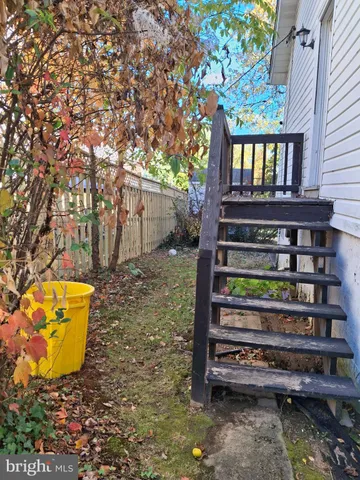 a view of a house with a wooden deck