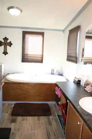 a bathroom with a sink a vanity and a mirror