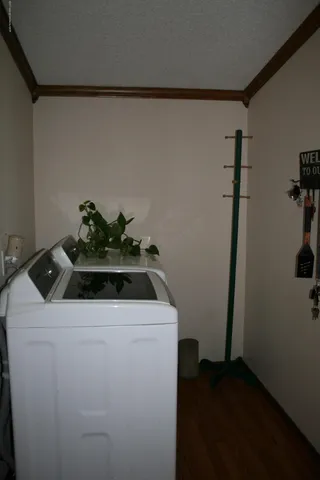 a white stove top oven sitting inside of a kitchen