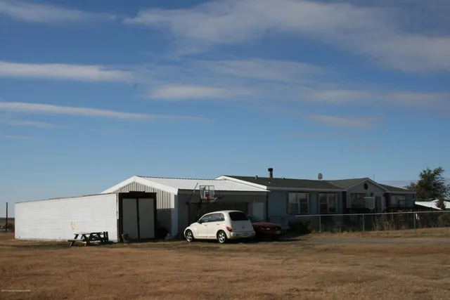 a car parked in front of a house