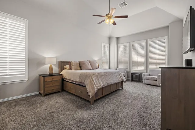 a kitchen with stainless steel appliances granite countertop a stove top oven a sink dishwasher and a refrigerator