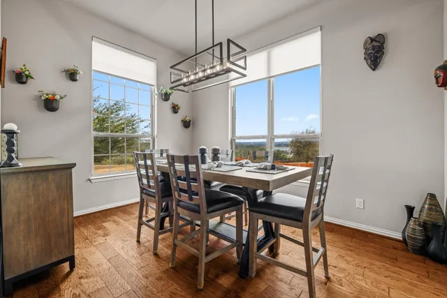 a view of an entryway with wooden floor and a livingroom view