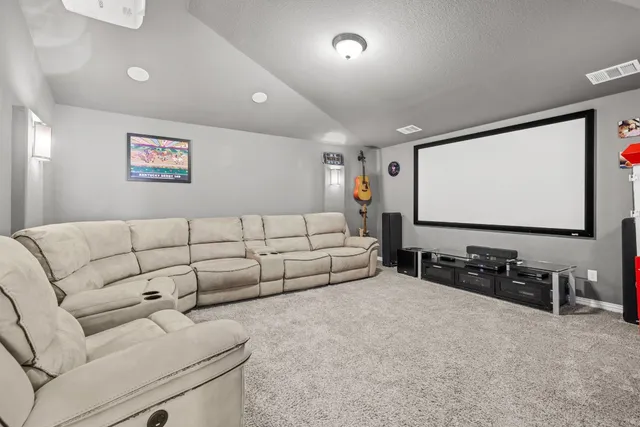 a living room with furniture and white walls