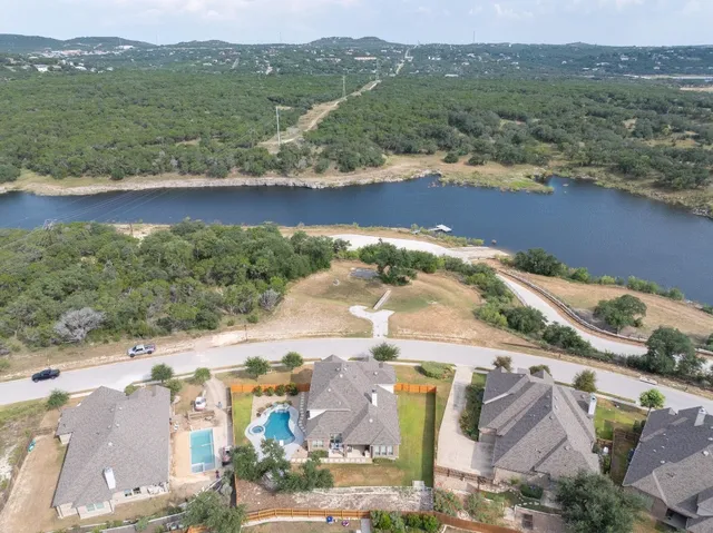 an aerial view of residential houses with outdoor space