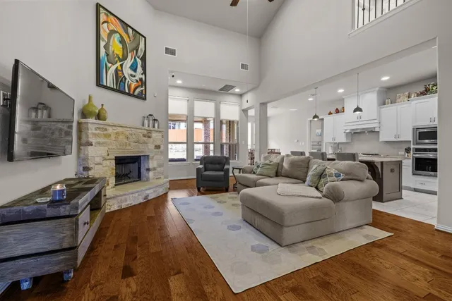 a living room with furniture and a fireplace