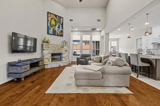 a living room with furniture flat screen tv and a fireplace