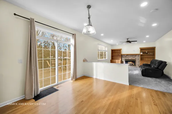 a view of a kitchen with furniture and a ceiling fan
