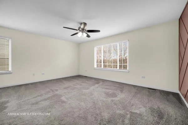 a view of empty room with windows