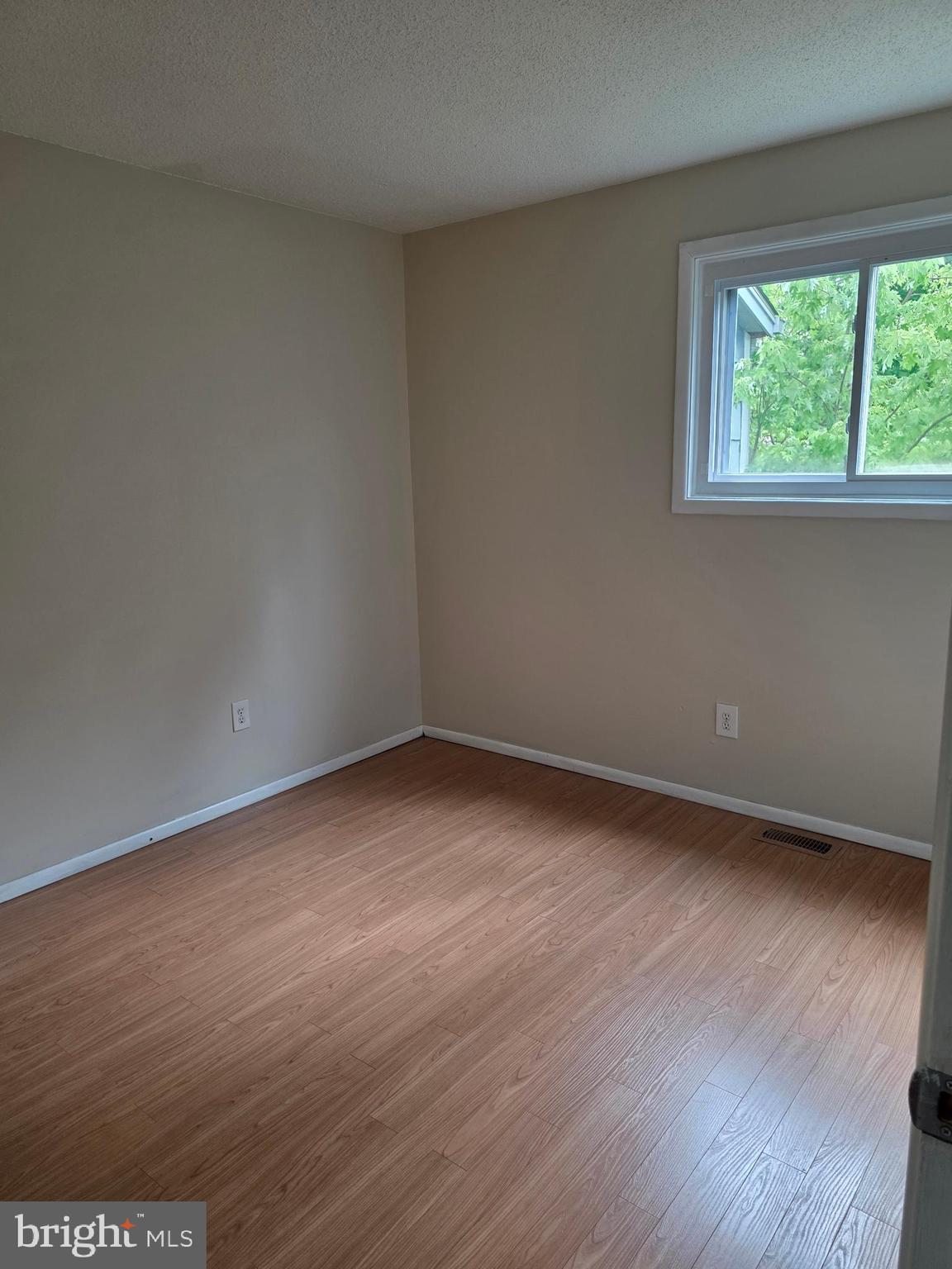 9 Georgetown Road Lindenwold, NJ 08021 - Photo 10 of 14 an empty room with wooden floor and windows