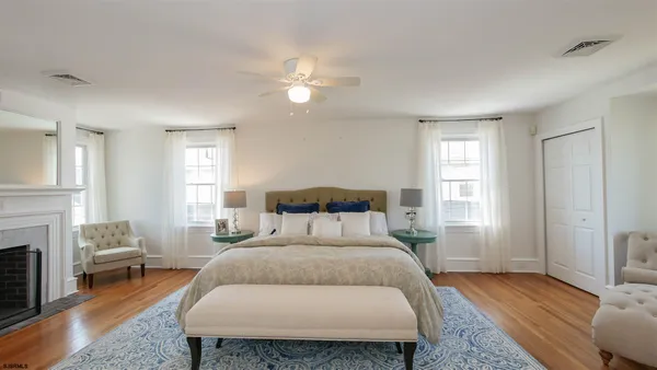 a bedroom with a bed and a couch