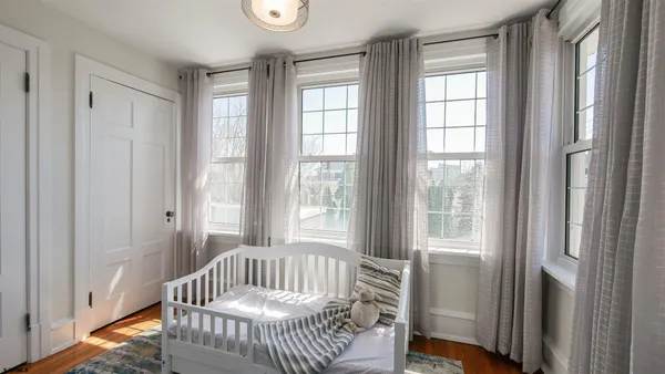 a bedroom with furniture and windows