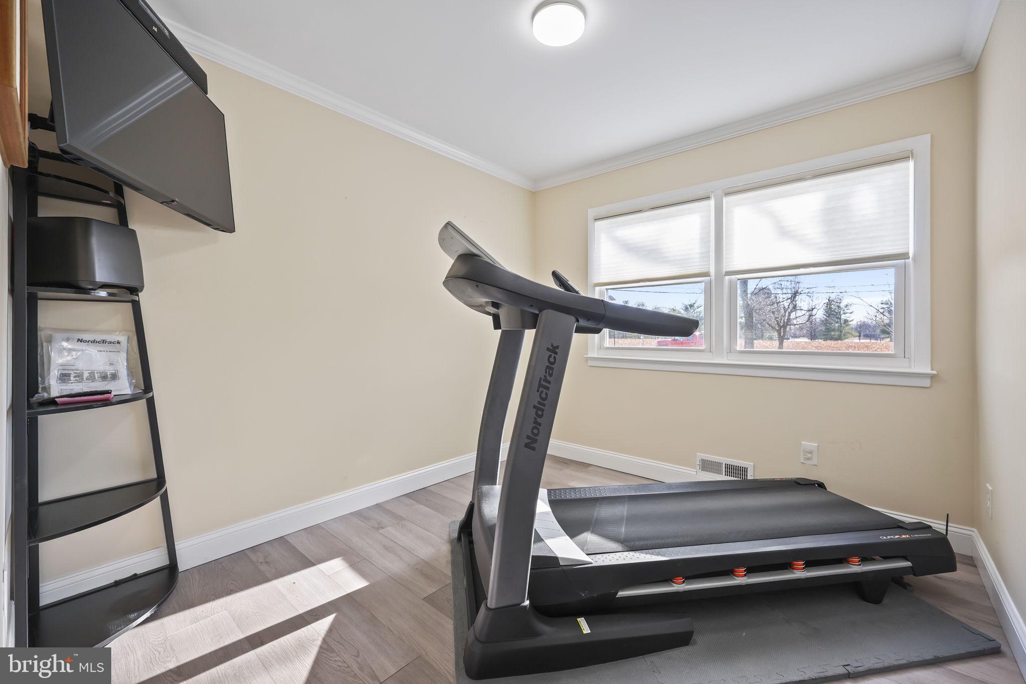 568 Village Road East Princeton Junction, NJ 08550 - Photo 15 of 43 a room with gym equipment and a window