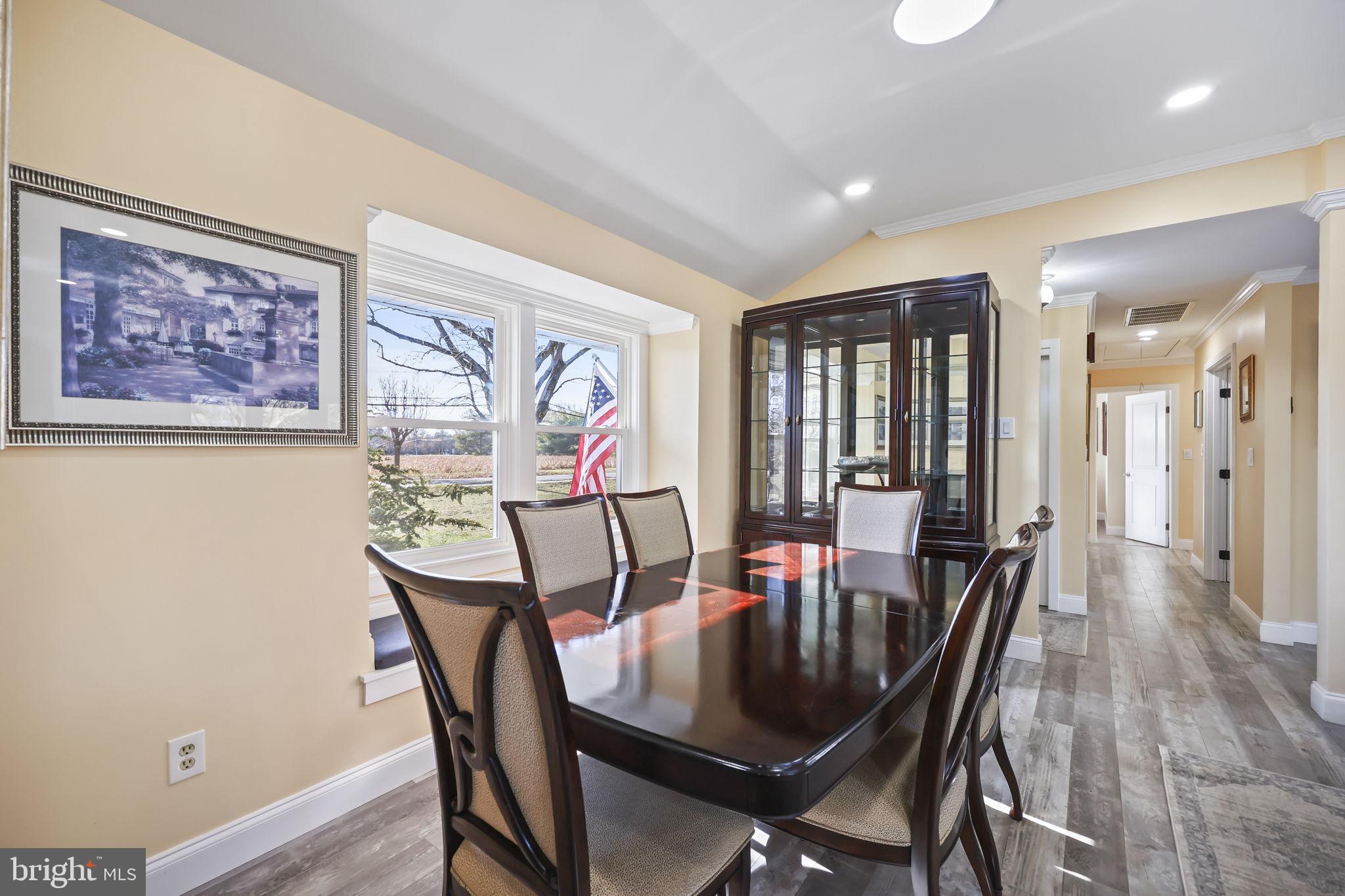 568 Village Road East Princeton Junction, NJ 08550 - Photo 17 of 43 a view of a dining room with furniture window and wooden floor