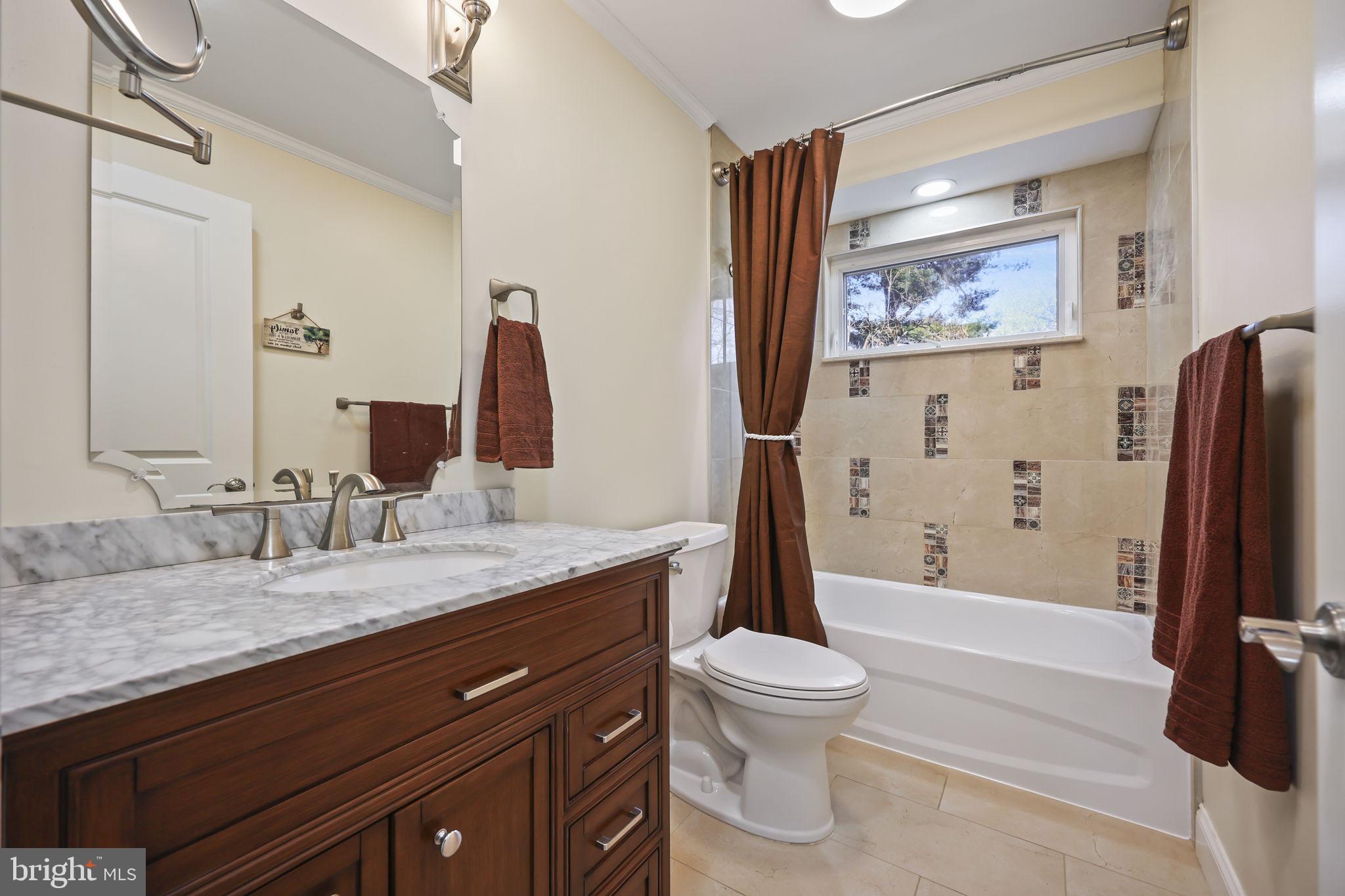 568 Village Road East Princeton Junction, NJ 08550 - Photo 19 of 43 a bathroom with a granite countertop sink toilet and shower