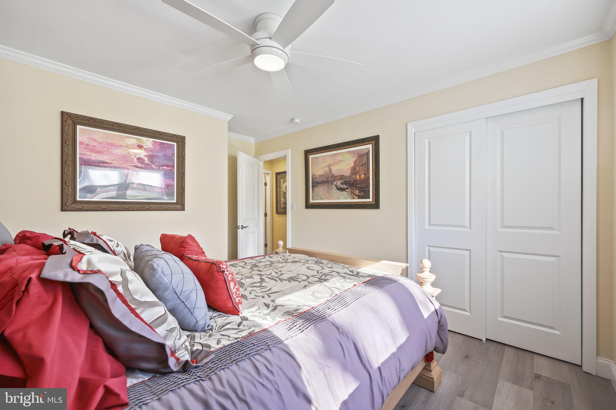 568 Village Road East Princeton Junction, NJ 08550 - Photo 21 of 43 a bedroom with a bed and a painting on the wall