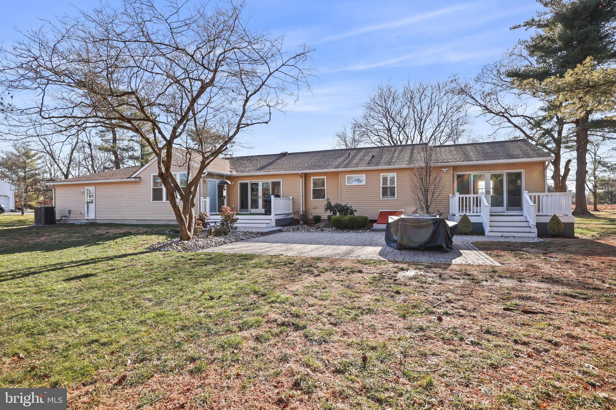 568 Village Road East Princeton Junction, NJ 08550 - Photo 37 of 43 a view of a house with a yard covered in snow